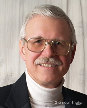 Robert John (“Bob) Helmacy